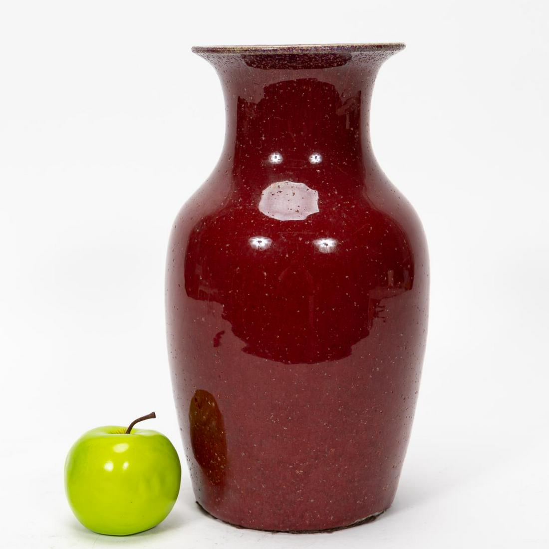 CHINESE DAOGUANG POTTERY OXBLOOD SHOULDER VASE: Chinese. possibly Daoguang (1820-1850). Oxblood or sang de boeuf pottery shoulder vase having a flared neck and tapering body. Wax export seal to underside but otherwise unmarked. Approx. 13.5", dia. 