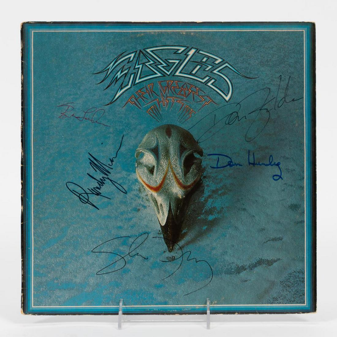 THE EAGLES, AUTOGRAPHED "GREATEST HITS" RECORD: The Eagles (American, formed 1971). An autographed "Greatest Hits" album or LP by Glenn Frey, Don Henley, Don Felder, Randy Meisner, and Bernie Leadon. Approx: 12.25" x 12.25".