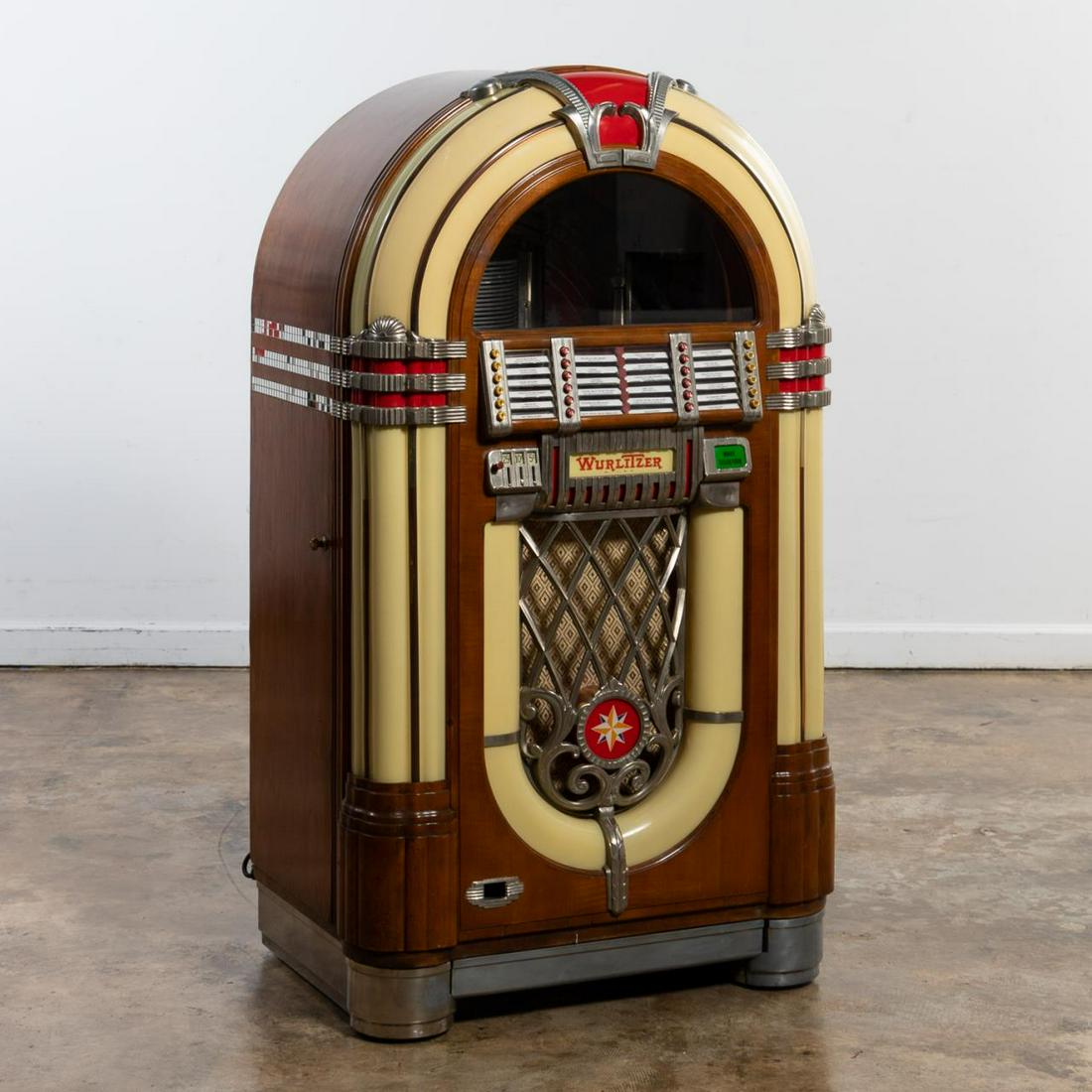 WURLITZER MODEL 1015 "BUBBLER" GOLDEN AGE JUKEBOX: Wurlitzer (American, founded 1853), Paul Max Fuller (Swiss, 1897- 1951), circa 1946. A golden age model 1015 "Bubbler" jukebox designed by Paul Fuller with color changing pilasters, eight bubble tubes