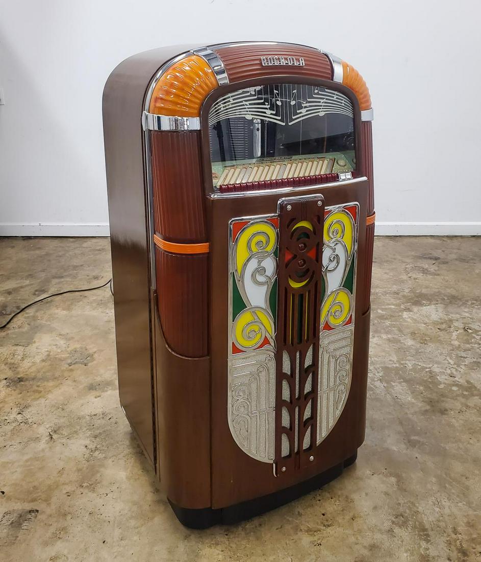 ROCK-OLA MODEL 1422 ART DECO JUKEBOX, CIRCA 1946: Rock-ola Manufacturing Corporation (American, founded 1927), circa 1946. A model 1422 series F Art Deco jukebox playing twenty selections of 78 records. Marked with serial number "87105" to back plate