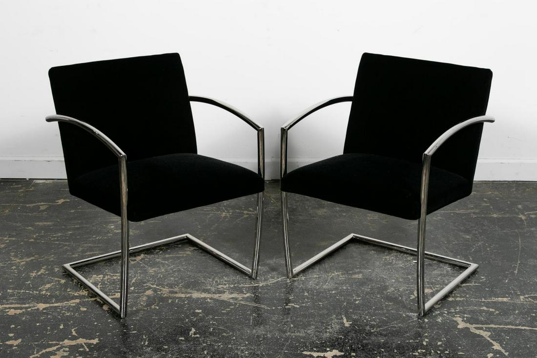 PAIR, ROMERO CANTILEVER CHAIRS BY BREUTON: Brueton Furniture (American, founded 1926), early 21st century. Pair of "Romero" cantilever chairs having a stainless steel frame with curved arms and black velvet back and seat. Apparently unmarked.