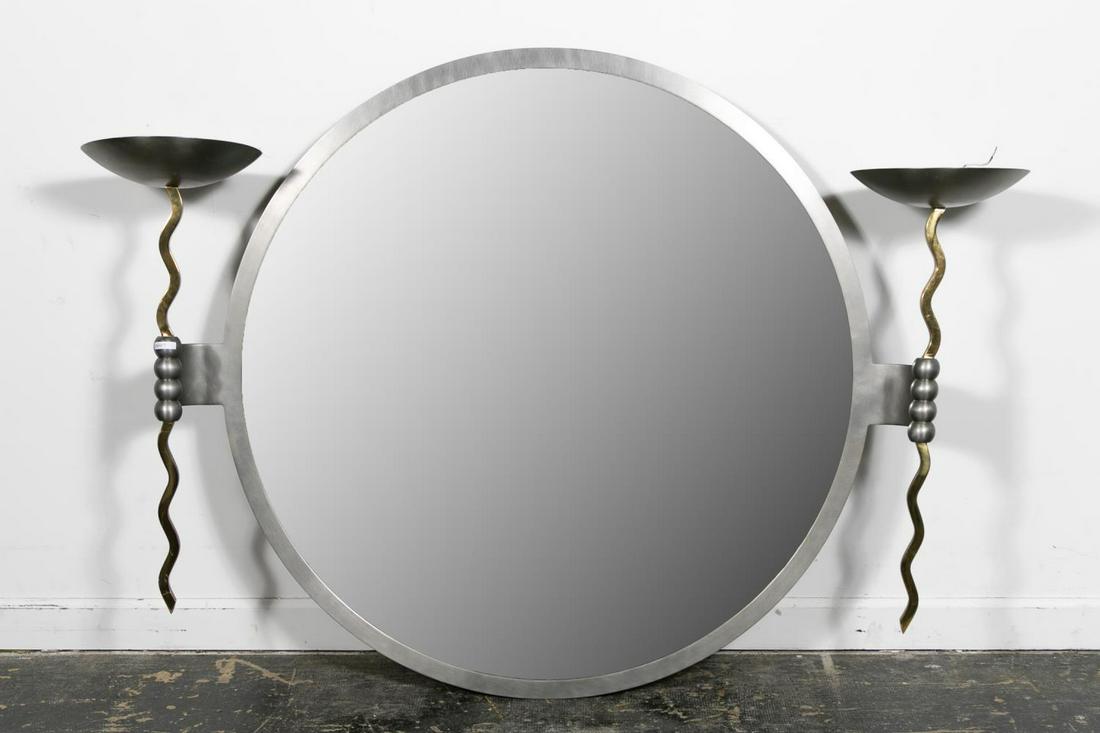 STANLEY JAY FRIEDMAN FOR BREUTON, FIST MIRROR: Stanley Jay Friedman for Brueton Furniture (American, est. 20th century), 21st century. A circular whimsical "Fist" mirror and sconces in copper and brushed steal. Approx. h. 48", w. 64.5", d. 18".