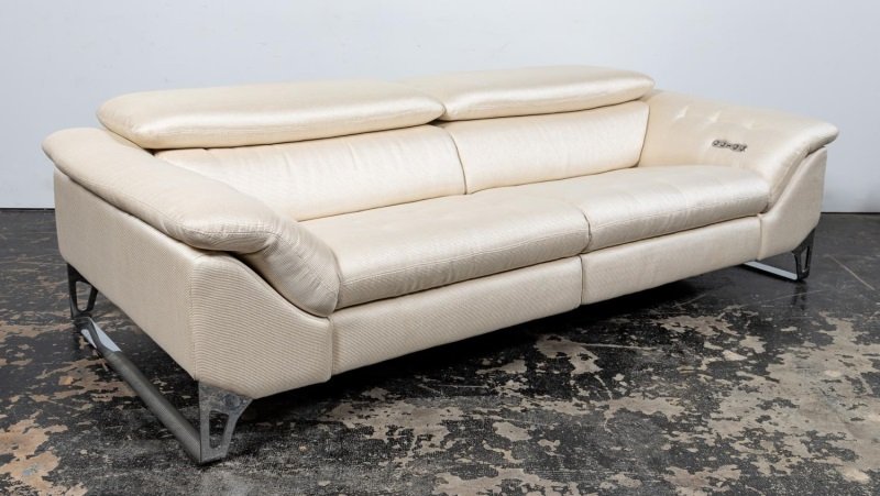 ROCHE BOBOIS CINETIQUE ADJUSTABLE 3-SEAT SOFA: Sacha Lakic (Serbian, b. 1964) for Roche Bobois (French, est. 1960), 21st century. A Cinetique white fabric three-seat sofa with chrome legs and having electric "Full Relax" settings for fold out foot