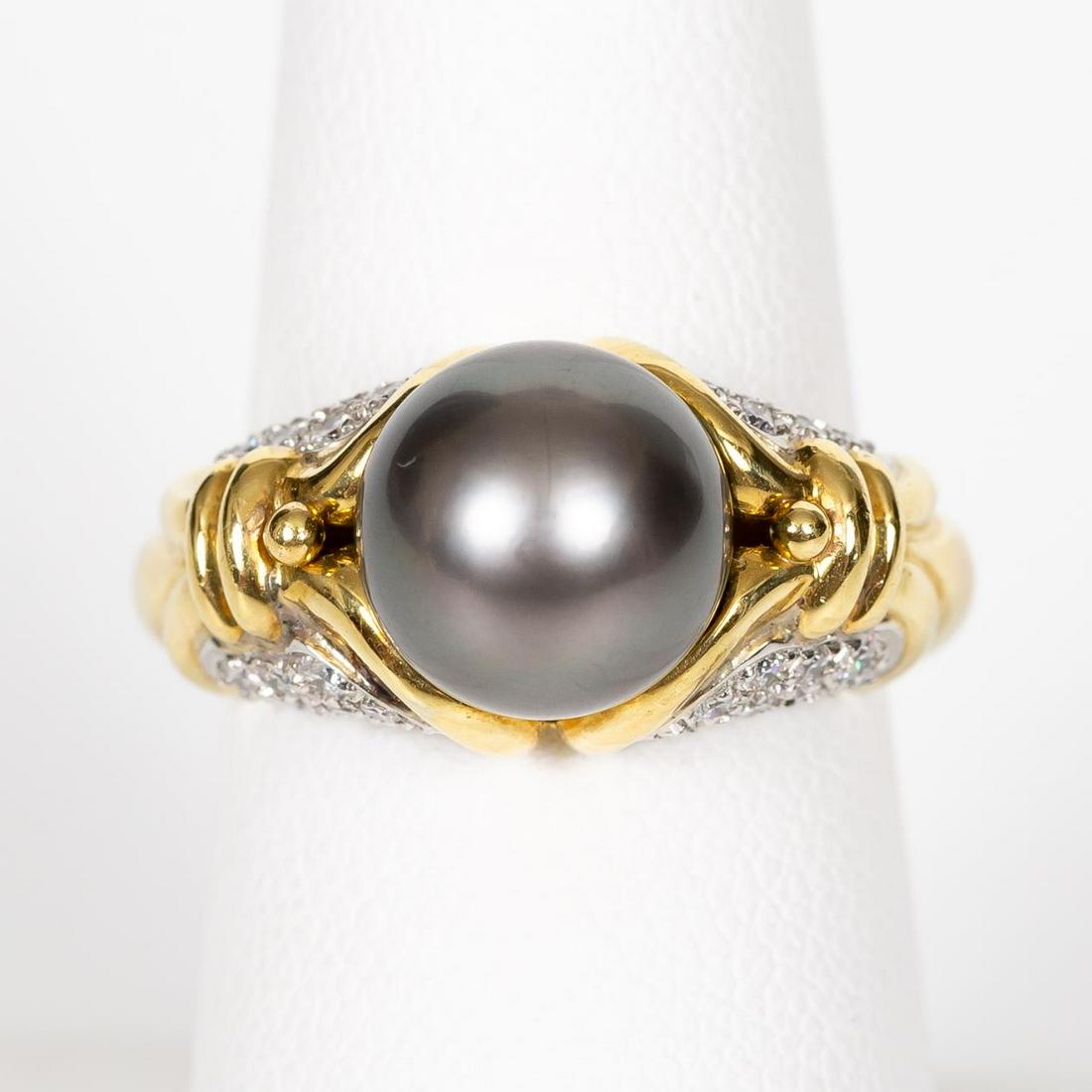 BLACK TAHITIAN PEARL & DIAMOND 18K GOLD RING: A ladies black cultured Tahitian pearl and diamond ring comprising of .45 ctw of diamonds. Marked to interior, 18k, P1950, and a EC in a circle. Approx. US size 7.25. Approx. total weight 12.3 g.