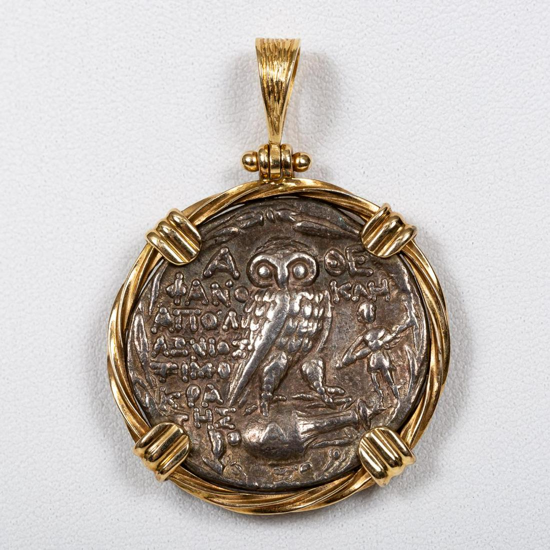 14K YG MOUNTED GREEK NEW STYLE TETRADRACHM PENDANT: Greek, coin circa 138 BC. An Attica Athens "New Style" silver Tetradrachm coin featuring head of Athena with a three-bush griffin helmet on front and an owl standing on an amphora vase & Artemis with 