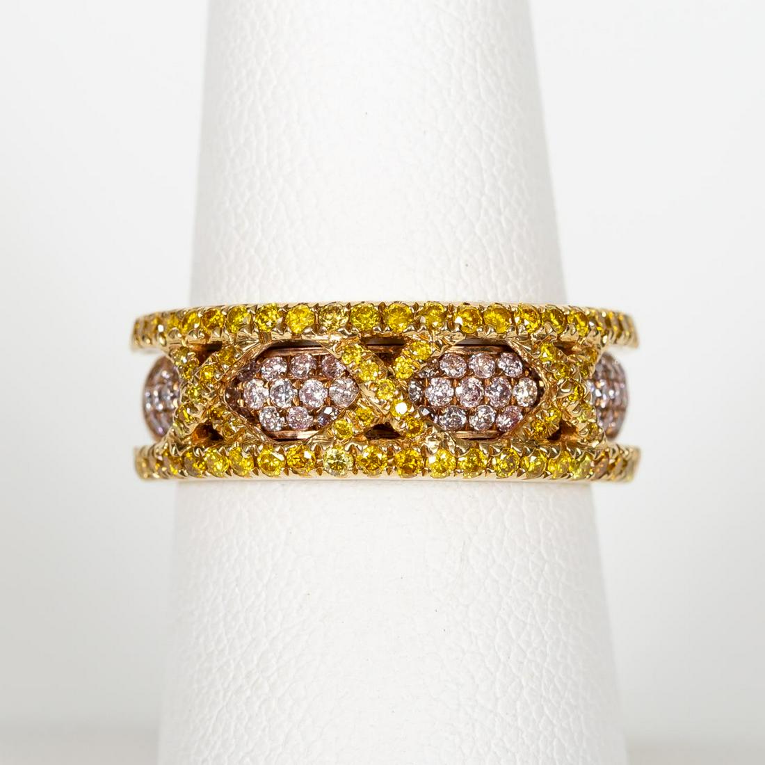 18K GOLD & DIAMOND "X" MOTIF RING, YELLOW & PINK: An 18k yellow and rose gold diamond pave and "X" motif ring comprising of yellow round cut diamonds (0.46 ctw) and pink round cut diamonds (0.46 ctw). Open shank to yellow diamond ring creating and in
