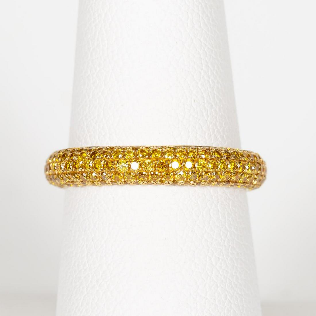 18K GOLD & YELLOW DIAMOND PAVE RING: An 18k yellow gold and pave yellow diamond ring comprising of round cut diamonds (0.81 ctw). Marked 18K, HANA, & DO81. Approx. US size 7. Approx total weight 2.2g.
