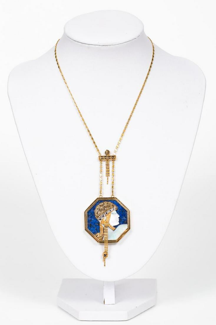 ERTE ART DECO-STYLE GOLD & LAPIS NECKLACE, PROFILE: A vintage, circa 1979, Erte limited edition art deco style 14k yellow gold necklace with an octagonal medallion comprising of lapis lazuli, mother of pearl, and six tiny sapphires. Marked to back of h