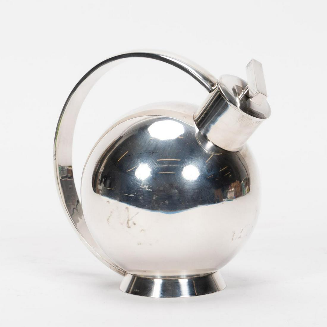 CONTINENTAL 935 SILVER MODERN TEAPOT LIKELY DANISH: Continental, likely Danish, possibly Per Visholm - Hjorring (Danish, started 1972). A 935 silver teapot with a modern spherical form, elongated handle and stretched handle. Marked "PV", "0.935" to the