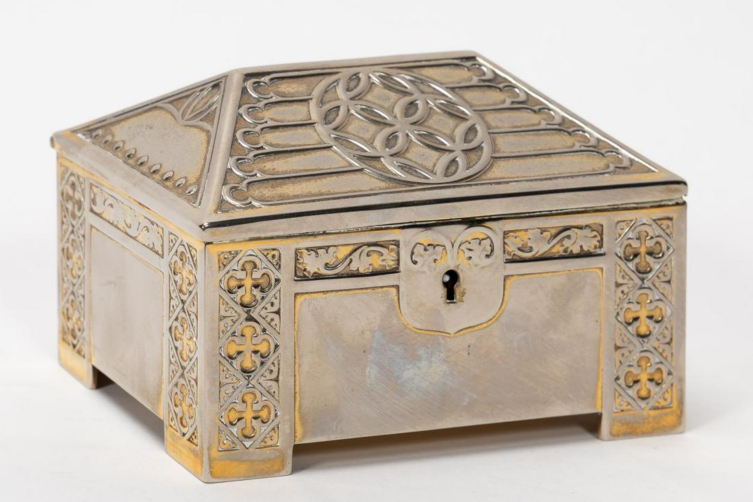 WMF SILVERPLATED ARTS AND CRAFTS CASKET, 1906: Wurttembergische Metallwarenfabrik (German, founded 1853), 1906. Small silverplate vermeil arts and crafts casket or cigarette box with gothic detail having a hipped lid with tracery and body decorate
