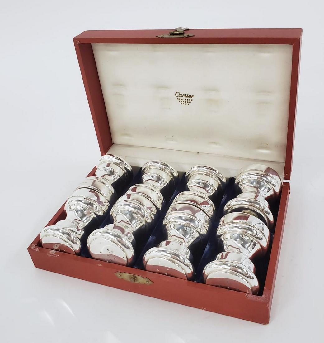 8 CARTIER, STERLING SILVER SALT & PEPPER SHAKERS: Cartier (French, founded 1847), circa 1980. An eight piece set of sterling silver salt and pepper shakers in a blue velvet lined Cartier box. Marked to underside "Cartier Sterling". Approx: h. 2.125",