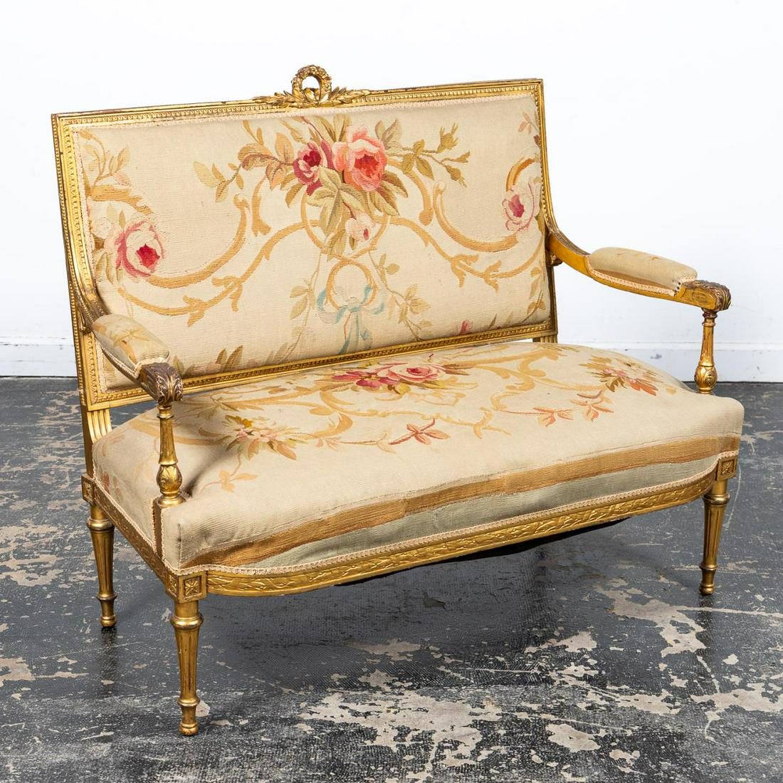 20TH C. S. KARPEN & BROS. GILTWOOD TAPESTRY SETTEE: S. Karpen & Bros. (American, 1880-1951), first quarter, 20th century. Giltwood settee in the Louis XVI taste having a rectangular back with laurel wreath crest, Aubusson type tapestry upholstery and r