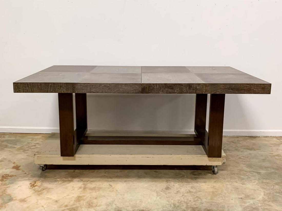 MICHAEL BERMAN MODERN "TROUSDALE" DINING TABLE: Michael Berman Limited (American, b. 1956-), early 21st century. A modern "Trousdale" dining table in gray walnut ceruse and brown legs. Accompanied by two leaves. Maker's mark to underside of table.