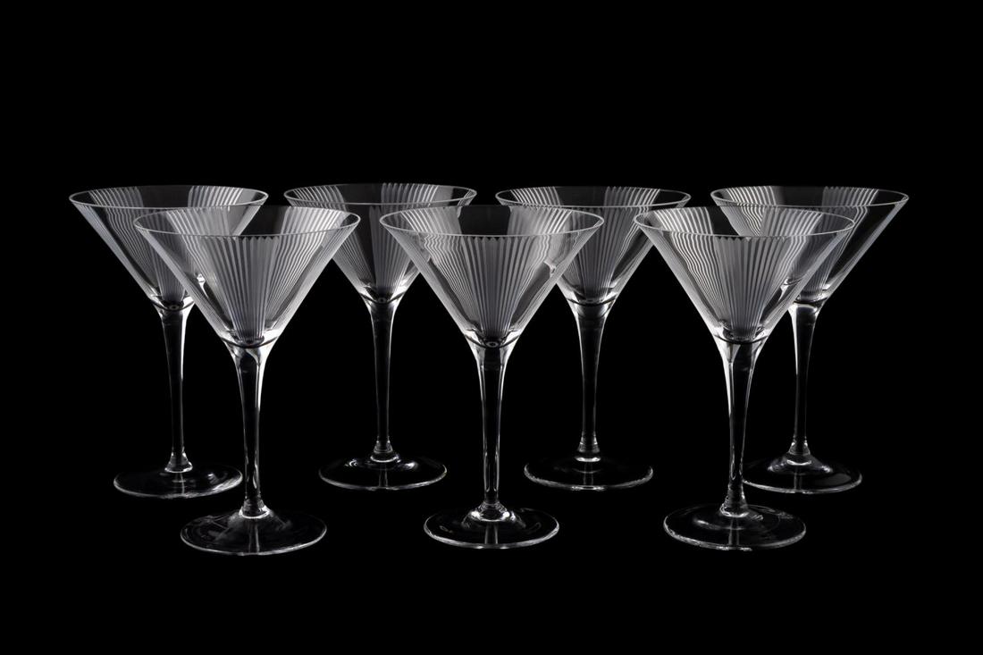 SEVEN TIFFANY & CO. ETCHED MARTINI GLASSES: Tiffany & Co., 20th century. Group of seven crystal martini glasses with etched fluted line motif. Maker's mark to foot. Approx. h. 7.25", diam. 4.75".