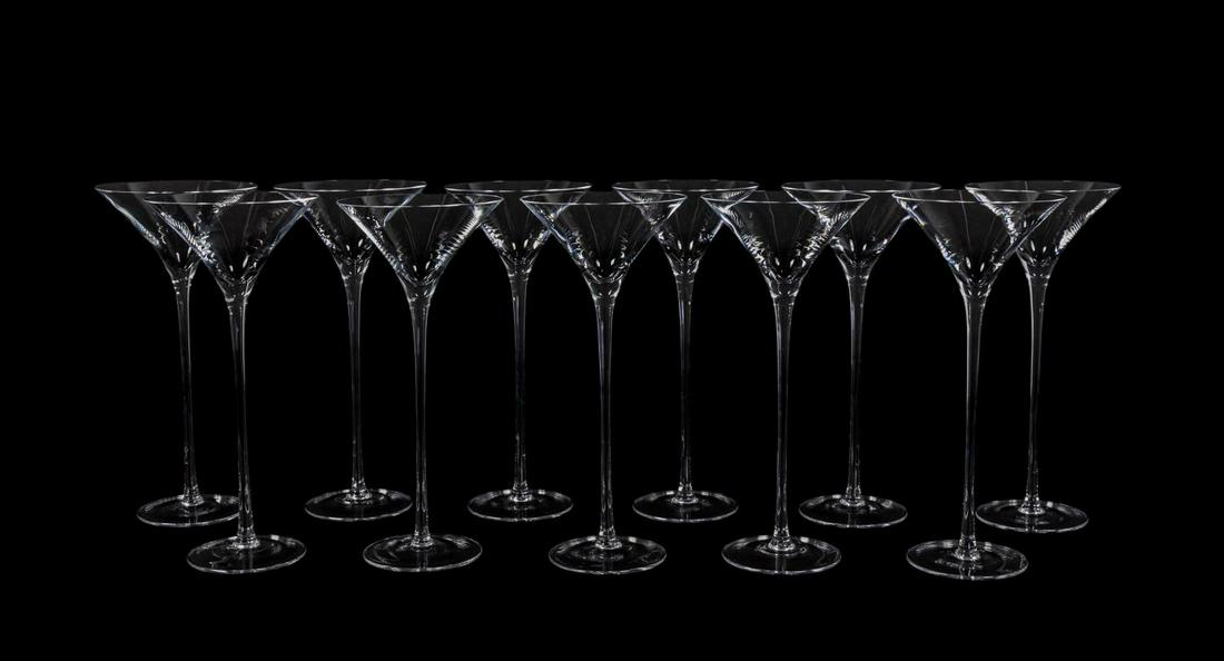 11 WILLIAM YEOWARD ARTIST SIGNED MARTINI GLASSES: William Yeoward, 2012. A set of eleven artist signed "Lillian" pattern tall martini glasses. Each signed by artist hand and acid etched "William Yeoward, American Bar" to underside. Approx: h. 11", w.