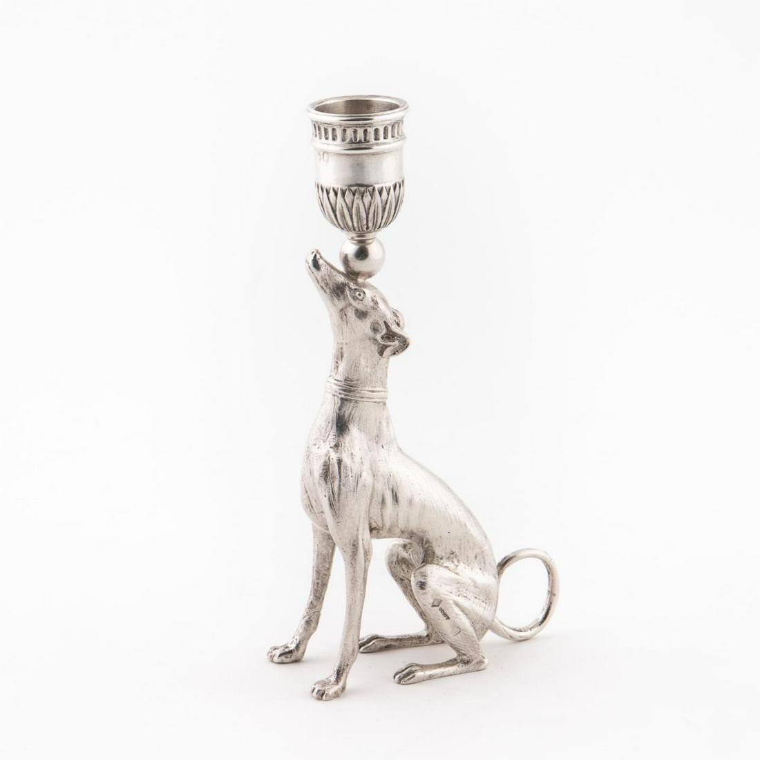 800 SILVER EMPIRE STYLE GREYHOUND CANDLESTICK: Odiot (French, founded 1690), 20th century. Empire style .800 silver single candlestick in a greyhound / dog form. marked to bowl and side of foot, Odiot, Minerva II, and Mason Odiot maker's mark. Not