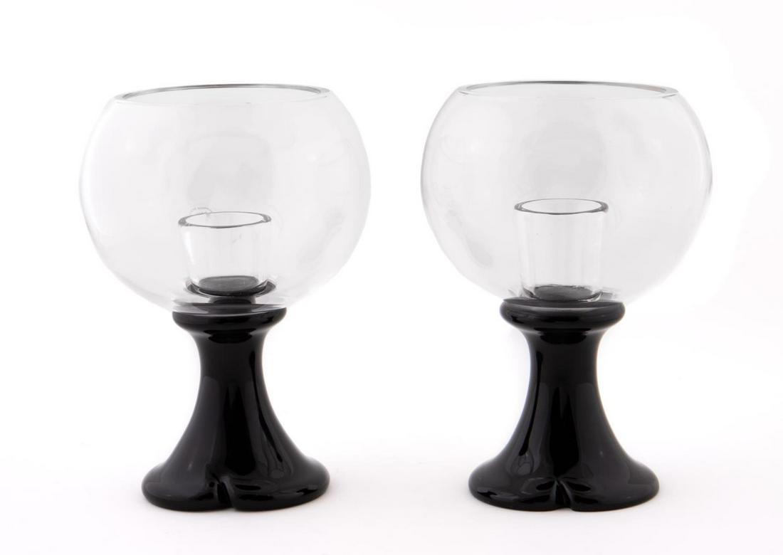 PAIR, SEGUSO GLASS CANDLESTICKS BY ELSA PERETTI: Italian, 21st century. A rare pair of black murano glass "thumbprint" pattern candlesticks designed by Elsa Peretti for Tiffany & Company with heavy glass hurricane style bowl. Stickers to each piece 