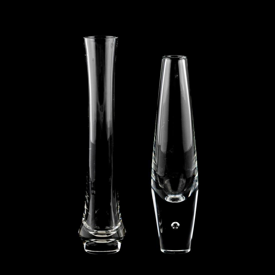 TWO STEUBEN CRYSTAL BUD VASES: Steuben, contemporary. Two crystal bud vases in the "Teardrop" and a giftware pattern. Both signed "Steuben" to underside. Approx: h. 9.5" (tallest).