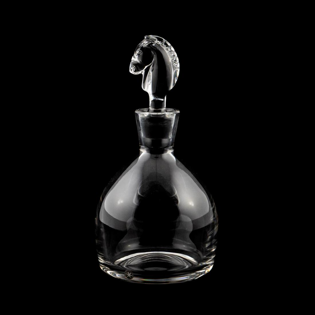 STEUBEN CRYSTAL EQUESTRIAN DECANTER: Steuben, contemporary. A crystal decanter with figural horse head stopper after Sidney Waugh's 1937 horse head sculpture. Marked to underside "Steuben". Approx: h. 10.75", w. 6".