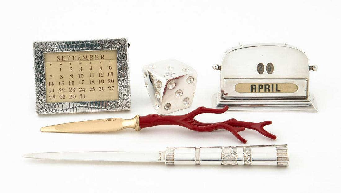 FIVE STERLING & SILVER PLATE DESK ITEMS, DESIGNER: English, French, and American late 19th / 20th century. Group of five sterling and silver plate desk accessories comprising of one sterling Tiffany & Co. calendar, silver plate Christofle dice and let