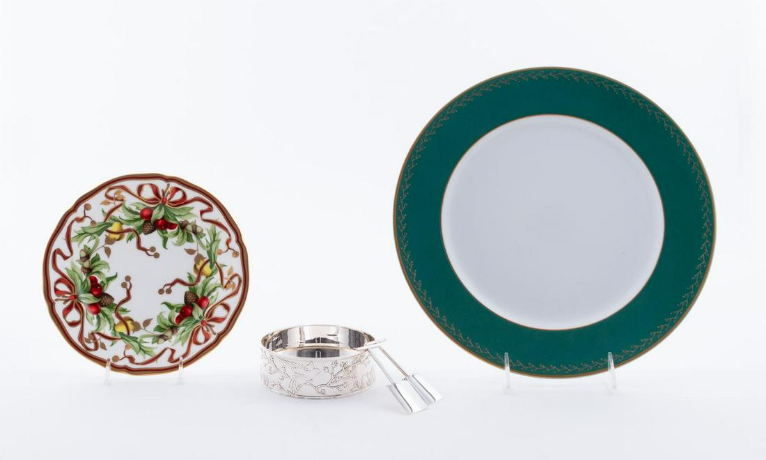 5 TABLEWARE PIECES BY TIFFANY & CO.: Tiffany & Co., early 21st century. Group of tabletop serving pieces comprising of one porcelain Audubon plate, one porcelain holiday plate, sterling silver wine bottle coaster with phoenix motif, and
