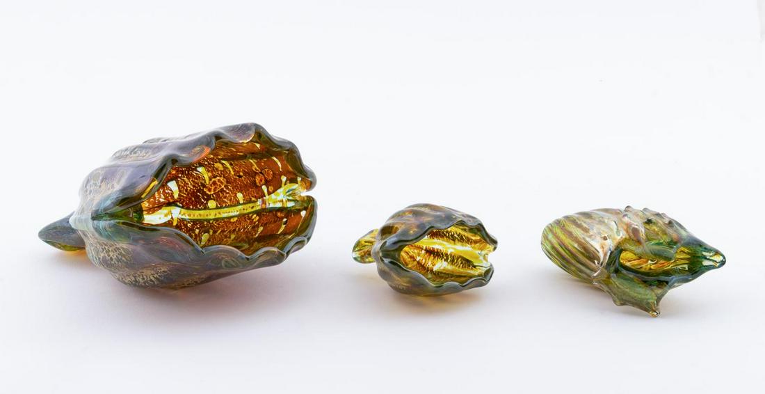 3, SEGUSO MURANO ART GLASS SEA SHELL SCULPTURES: Seguso Viro Co. (Italian), contemporary. Group of three Murano "conchiglie" iridescent and green blown glass seashells. Etched maker's mark to edges of each piece. Approx. h. 6", w. 6" (largest), h. 3