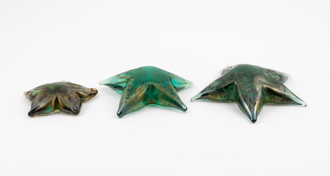 3 SEGUSO MURANO ART GLASS SEA SHELL SCULPTURES: Seguso & Seguso Viro Co., contemporary. Group of three Murano green blown glass and iridescent accent starfish form sculptures. Two marked "Seguso Murano" to edge, one marked "Seguso Viro Murano". App