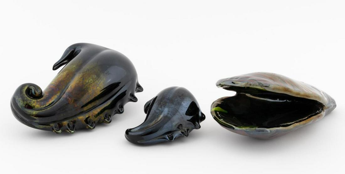 3 SEGUSO VIRO MURANO BLACK GLASS SEA SHELLS: Seguso Viro Co. (Italian), contemporary. Group of three hand blown Murano glass sea shells having iridized and striped motif. Etched maker's mark on side. Approx. h. 7.875" (tallest), h. 4.375" (small