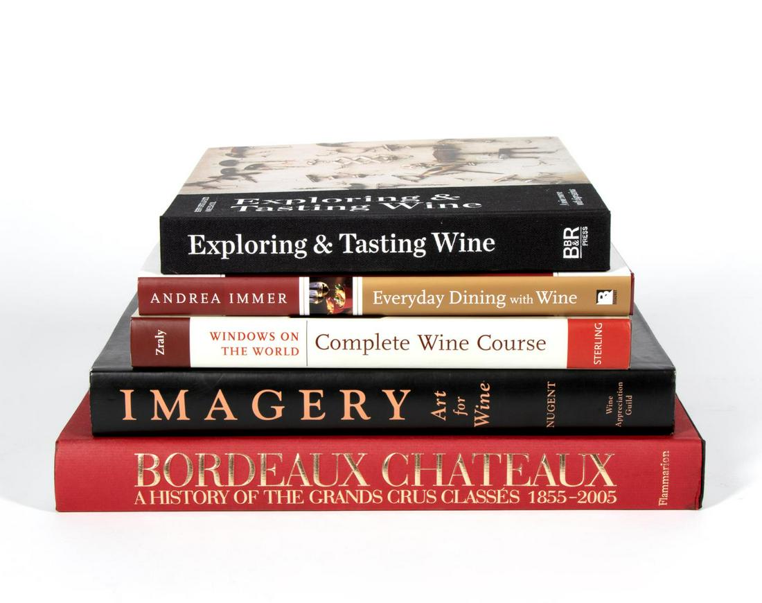 FIVE HARDCOVER BOOKS ON EXPLORING THE ART OF WINE: A grouping of five hardcover coffee table books on the art of wine including a copy of "Imagery - Art for Wine" signed by Bob Nugent and "Bordeaux Chateaux" published by Flammarion. Approx: h. 12.5", 