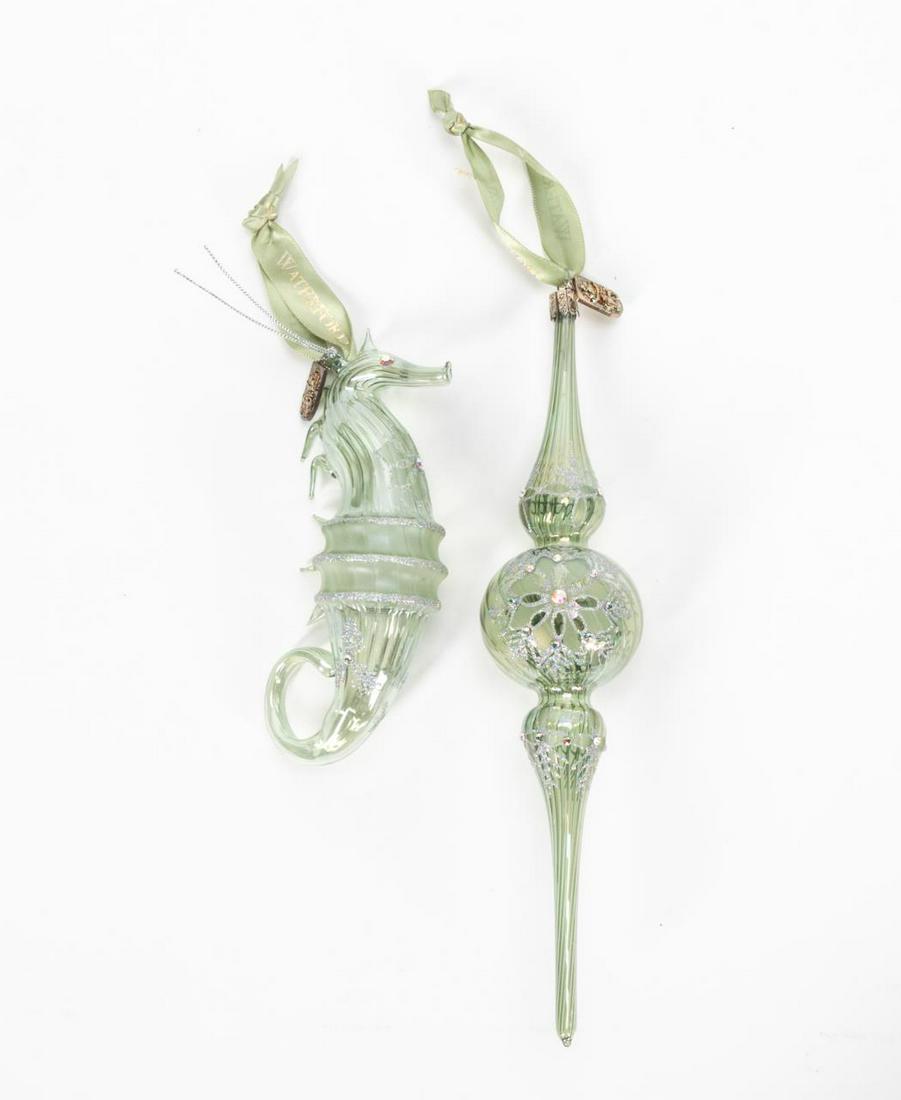 2 LIMITED ED. WATERFORD GLASS CHRISTMAS ORNAMENTS: Waterford, Contemporary. Two limited edition hand blown glass christmas ornaments with jeweled bodies in the form of a seahorse and drop pendant. Each marked "Waterford". Approx: h. 10", w. 3" (Larges