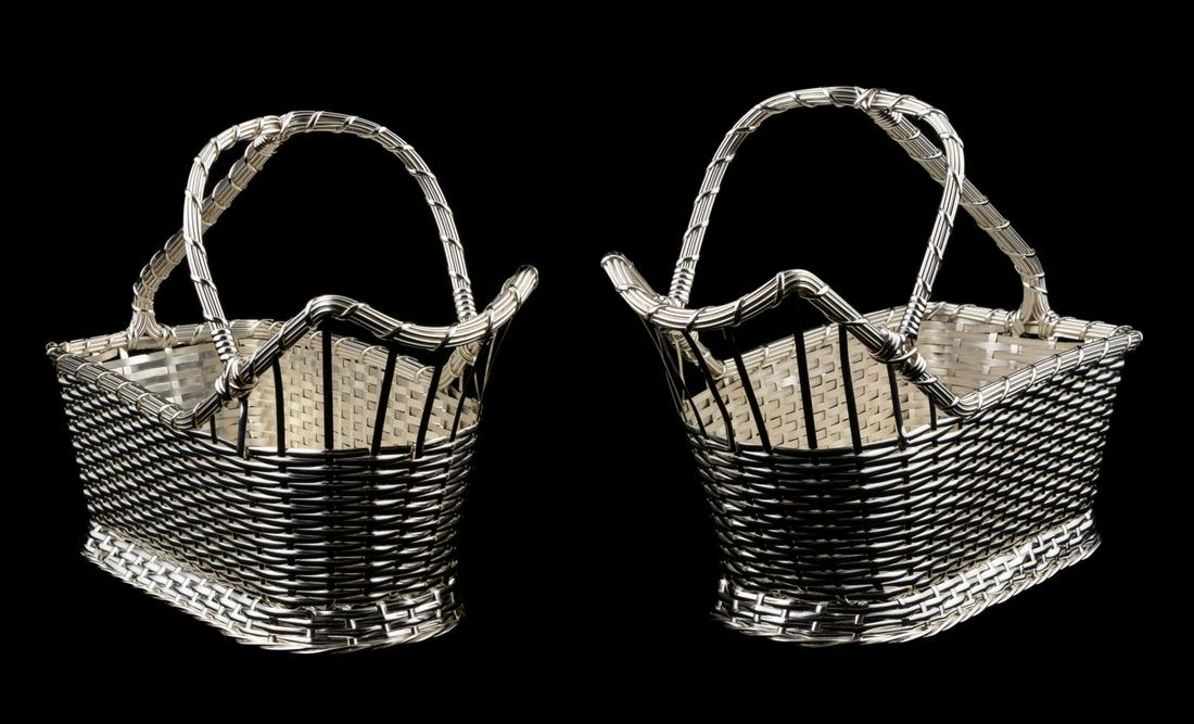 PAIR, CHRISTOFLE WOVEN WINE CADDY BASKETS: Christofle, contemporary. Pair of woven silver plate wine caddy baskets each having a single handle. Marked to the underside. Provenance: Acquired from Christofle, 2005 Approx. of one, h. 7"w. 9.5", d