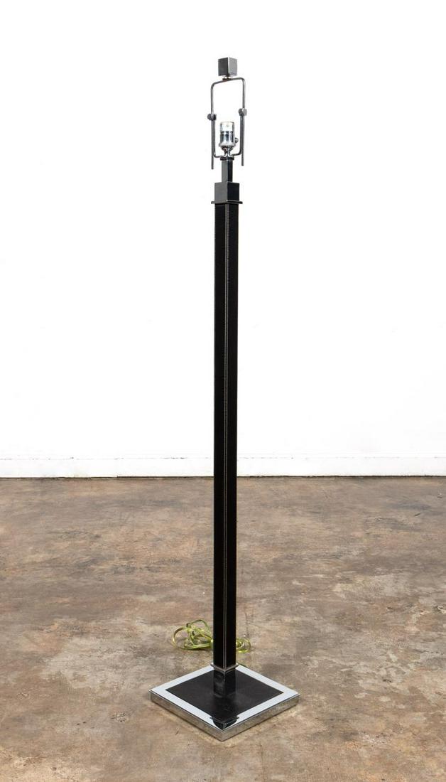 RALPH LAUREN BLACK LEATHER MODERN FLOOR LAMP: Ralph Lauren Home, contemporary. Modern black leather and chrome floor lamp having white stitched detail. Accompanied by black shade and adjustable harp. Apparently unmarked. Approx. h. 61", w. 10.25"