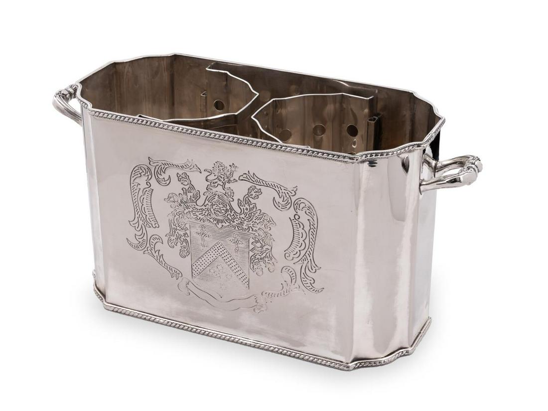 DUAL HANDLED SILVER PLATED ARMORIAL WINE COOLER: Contemporary. Double handled silver plated wine cooler having a coat of arms to each side, two-compartments with removable dividers and gadrooned edges. Crossed keys hallmark and marked "EP". Approx. 