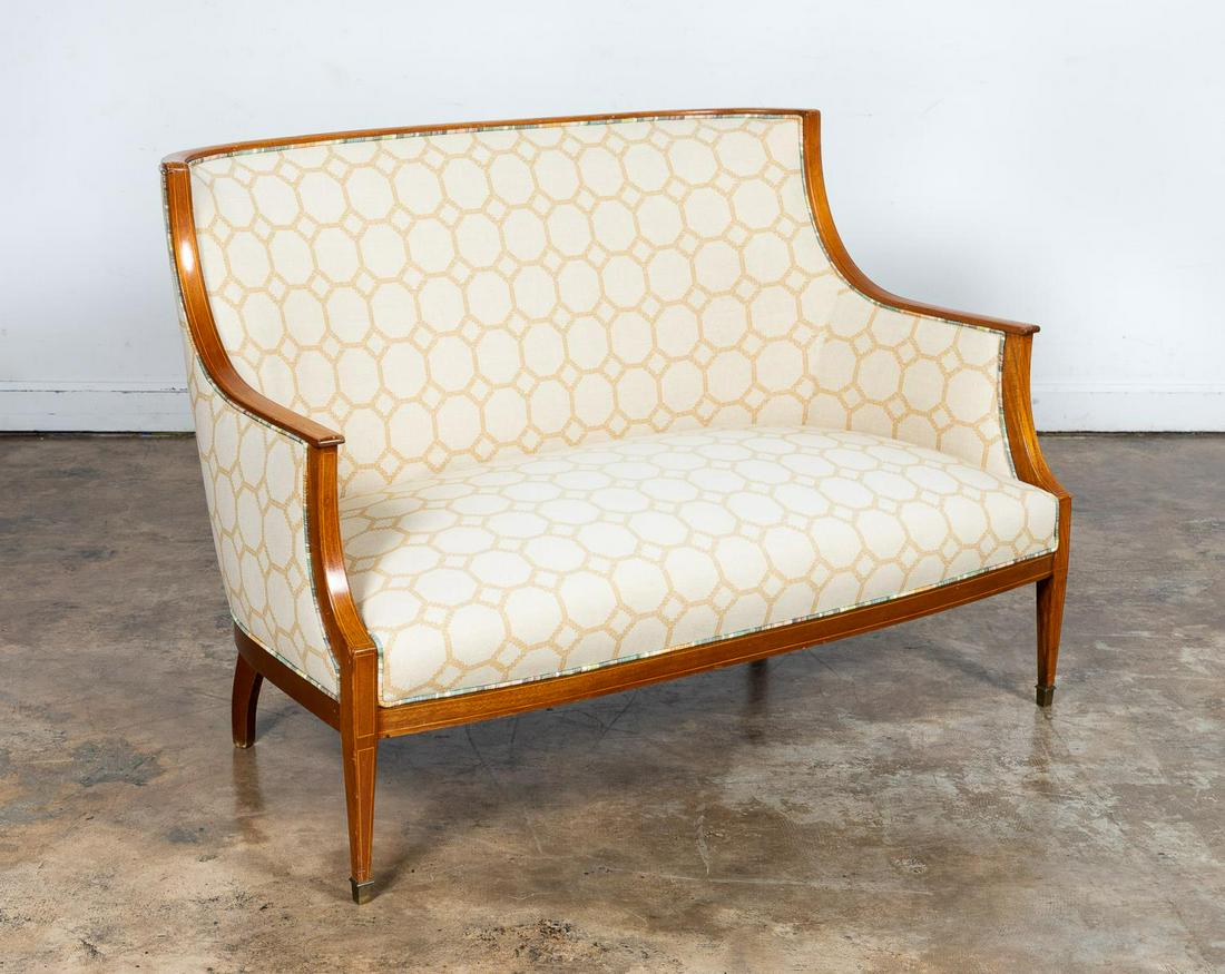 NEOCLASSICAL STYLE WALNUT UPHOLSTERED SETTEE: Continental, 20th century. Curved back walnut settee in the Italian neoclassical taste having string inlay, geometric upholstery and rising on tapered legs. Unmarked. Approx. 35.5", w. 50.25", d. 23.5