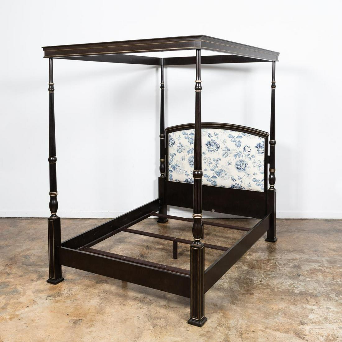 BAKER DARK WOOD & CHINTZ FABRIC CANOPY BED FRAME: Baker Furniture, 20th century. Empire style dark wood bed frame with fluted and silver gilt posts, and a blue and white chintz fabric accent. Marked to plaque on headboard. Approx. h. 93.5", w. 67" (o