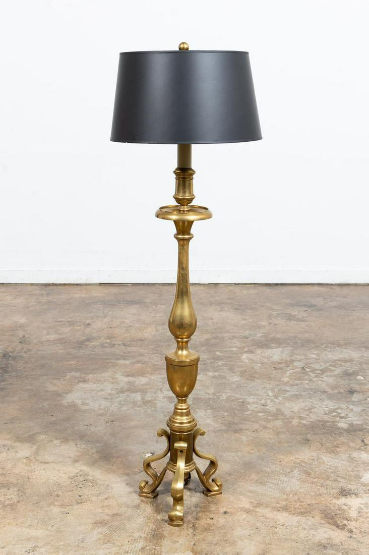 CHAPMAN CANDLESTICK BRASS FLOOR LAMP: Chapman Manufacturing Co., 20th century. A brass William & Mary style candlestick floor lamp with 3 sockets and black shade with gold interior. Labeled to one socket. Approx. h. 59" with shade