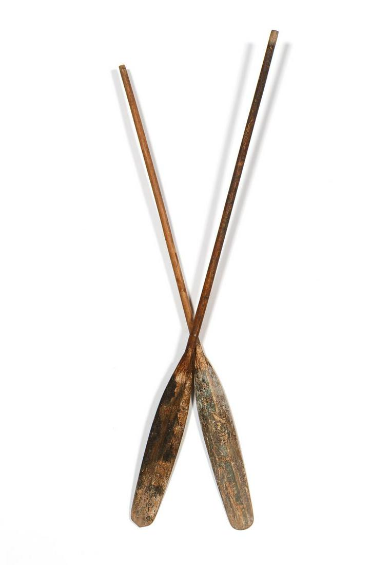 SOUTHEAST ASIAN POLYCHROME WOOD OARS: South East Asian. Pair of wooden oars with polychrome painted maritime or nautical scenes possibly with Buddhist gods, attached by nail. Apparently unsigned. Provenance: Acquired from Regen Leigh Anti