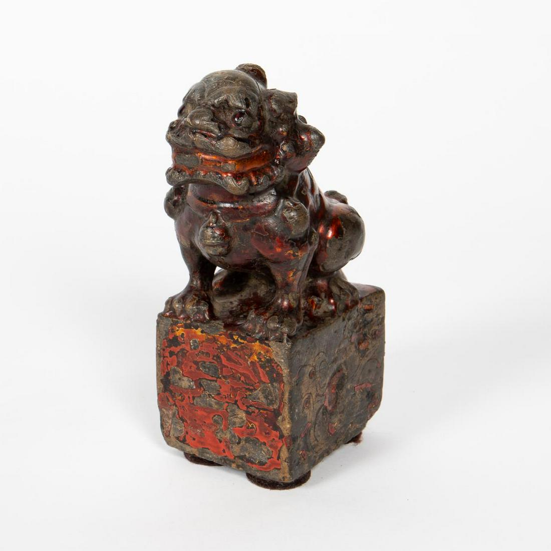 CHINESE, PARTIAL ENAMELED STONE GUARDIAN LION: Chinese. A unique carved stone guardian lion figure with rust colored enameling to surface. Apparently unmarked. Provenance: Acquired from Wing Kuen Ko, owner of KoKo Chinese Antiques in New York, in