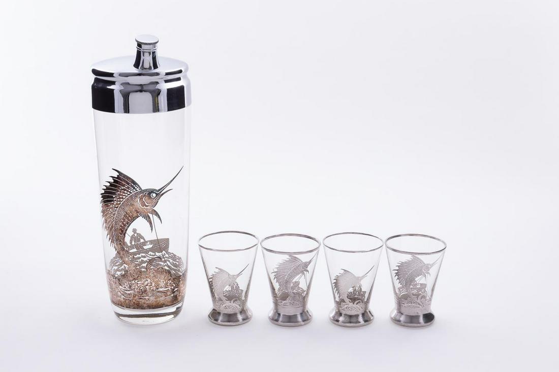 5PC ROCKWELL SILVER CO. SILVER OVERLAY DRINK SET: Rockwell Silver Co (American), early 20th century. Five piece set of silver overlay glass barware with sailfish leaping over waves and fishing boat. Comprising of one cocktail shaker and four shot gla
