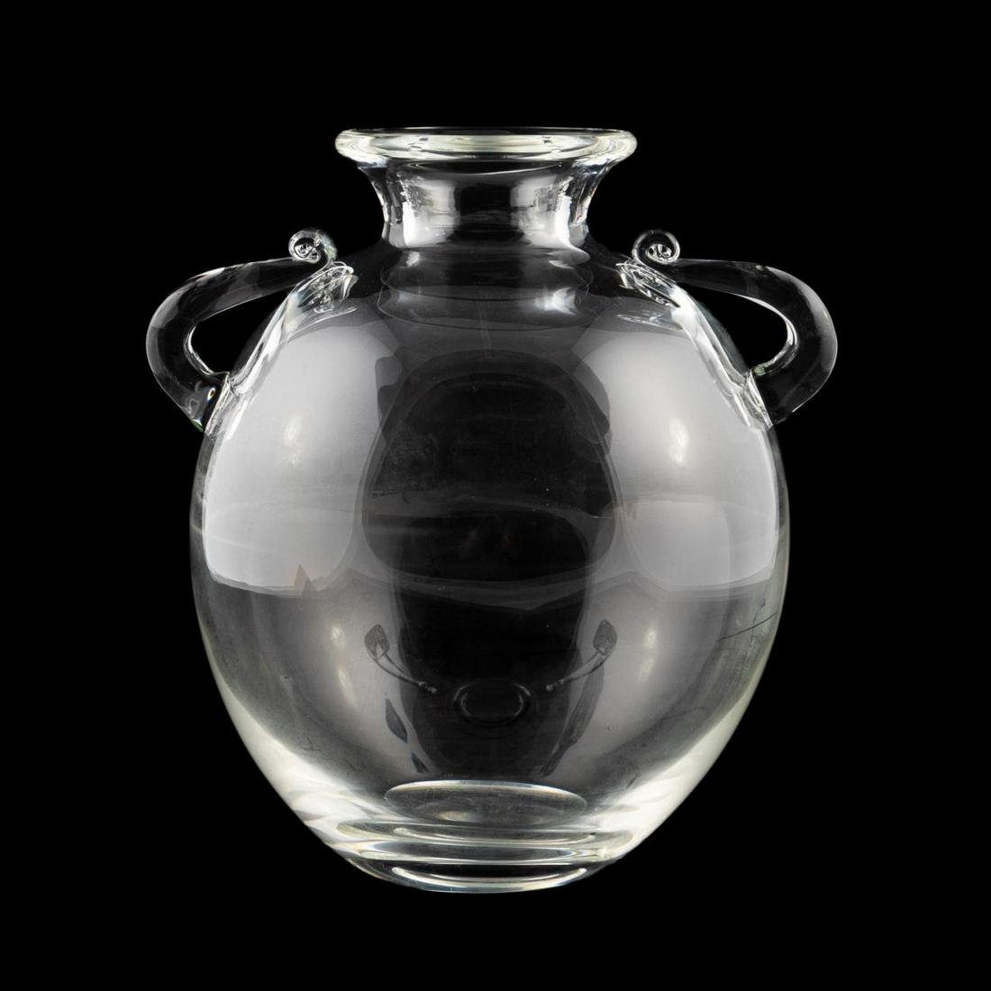 STEUBEN CRYSTAL "MINOAN" DOUBLE HANDLED VASE: Steuben, circa 2000. "Minoan" colorless crystal vase with scroll and handles and an amphora shape. Design by Joel Smith. Etched maker's mark to underside. Approx. h. 12.5".