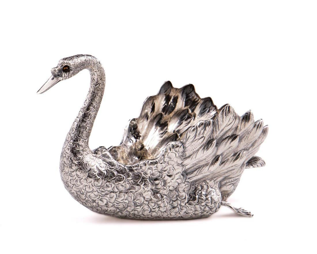 BUCCELLATI STERLING SILVER SWAN CANDY DISH: Buccellati, contemporary. Small Italian sterling silver swan form candy dish with tiger eye stone eyes. Accompanied by dust bag. Maker's mark to underside, "Italy", "Sterling", and ".925". Approx. tot