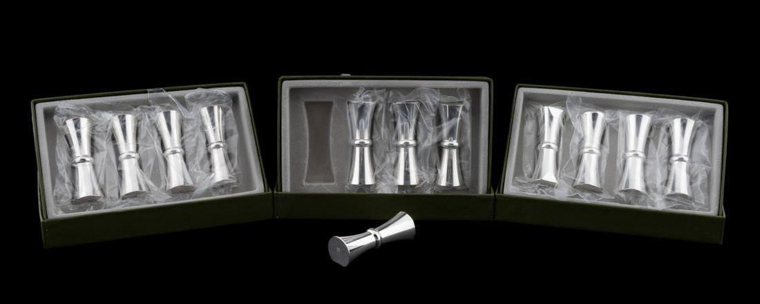 12 CHRISTOFLE "BABYLONE" SILVERPLATE KNIFE RESTS: Christofle, contemporary. Set of twelve "Babylone" silver plate knife or chopstick rests having a double trumpet form. Each marked. approx. of one, h. 0.375", w. 2.5", d. 0.5"