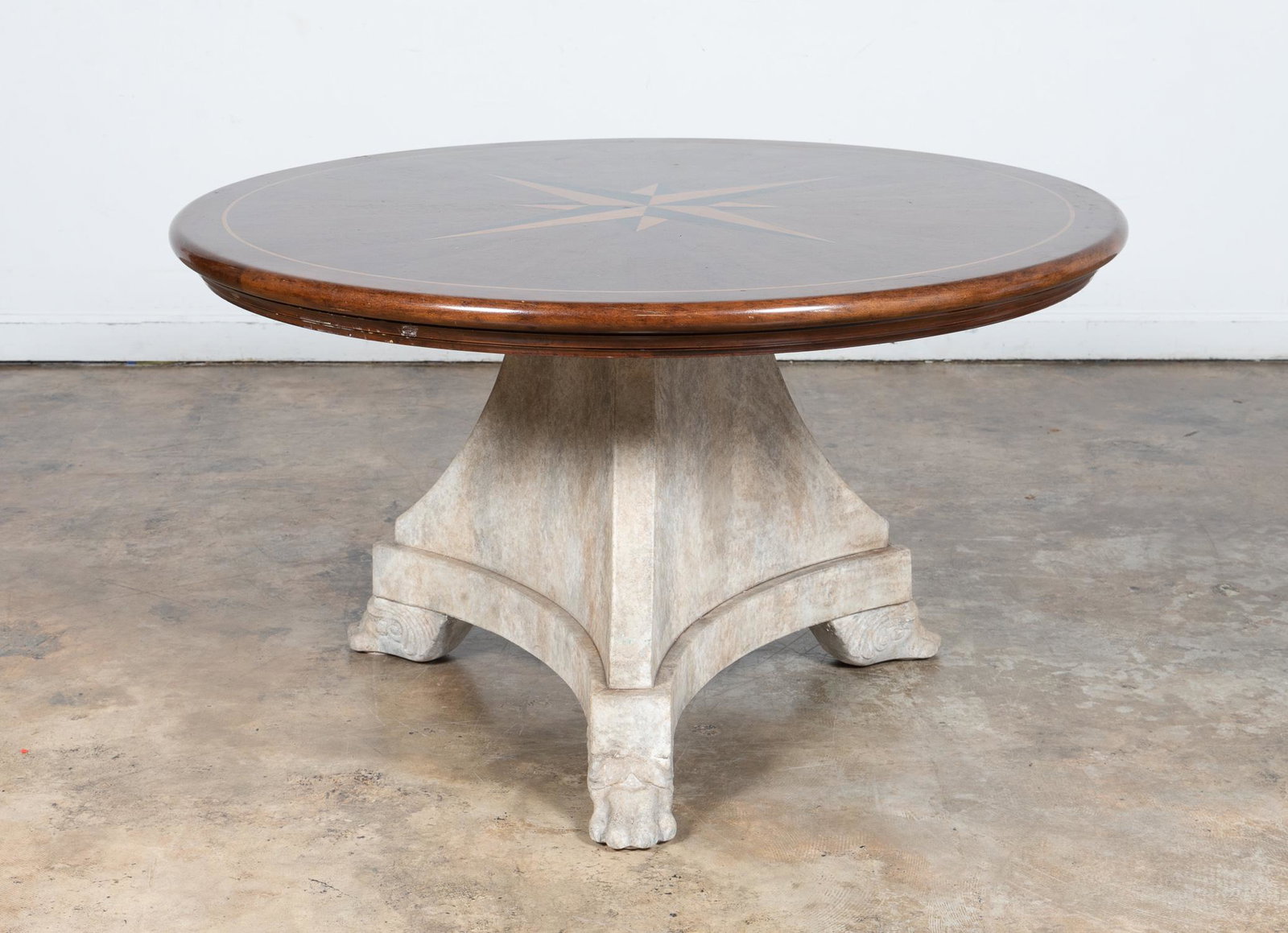 EMPIRE STYLE DINING TABLE, INLAID CIRCULAR TOP: American or Continental, 20th century. Empire style large dining table with inlaid star and composite base, in the style of Baker Furniture. Apparently unmarked. Approx. h. 30", diam. 53.5".