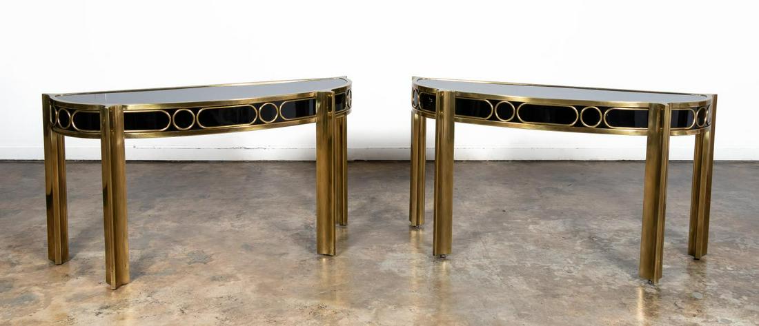 PAIR, MASTERCRAFT BRASS & LACQUERED CONSOLE TABLES: Mastercraft, circa 1970s. Pair of demilune brass and black lacquer console tables. Maker's plaque to back of both tables. Approx. h. 32.5", w. 60.5", d. 19.25".