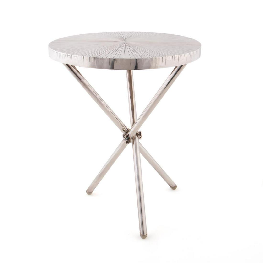 MICHELE DONER FOR CHRISTOFLE "RADIENT" SIDE TABLE: Michele Oka Doner (American, b. 1945-) for Christofle, 2005. Modernist silver plate side table with "Radient" top and tripod legs accented with small flowers. Approx. h. 19.75", diam. 15.625".