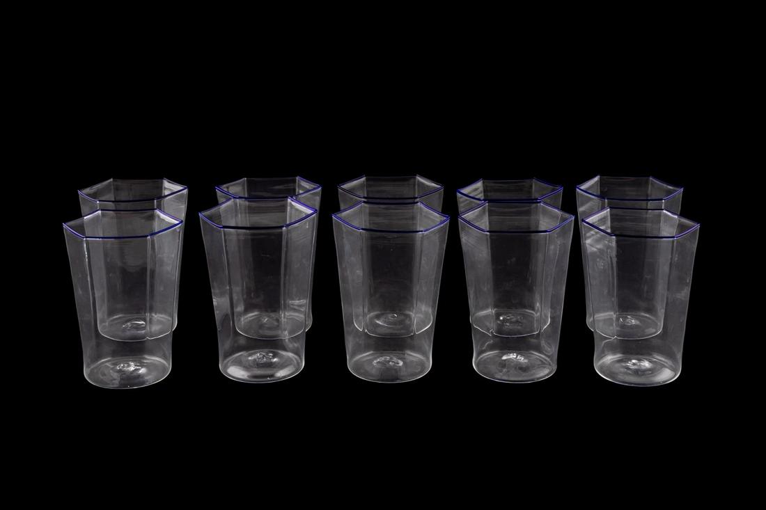 10 SEGUSO DELICATE COLORLESS TUMBLERS, BLUE RIM: Seguso Viro Co. (Italian), contemporary. Set of ten Murano blown glass "Esagonali" polygon tumblers / juice glasses having blue rim. Apparently unsigned. Provenance: Purchased from Nina Griscom, New Y