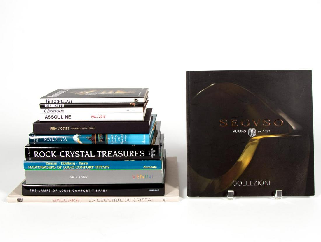 12 BOOKS ON NOTABLE DESIGN FIRMS & OBJET D'ART: A collection of twelve hardcover coffee table books on famous designers and objet d' art, including "Buccellati" by Assouline, "Christofle" by Assouline, "Fornasetti"by Assouline, "L'Objet", "Majolica