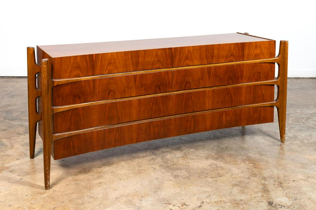 WILLIAM HINN MCM "EXOSKELETON" CREDENZA: William Hinn (Swedish) for The Urban Furniture Co., mid 20th Century. A walnut "Exoskeleton" long chest with sculptural curved front. Marked on back "Made in Sweden".Approx. h. 34", w. 78" (at widest 
