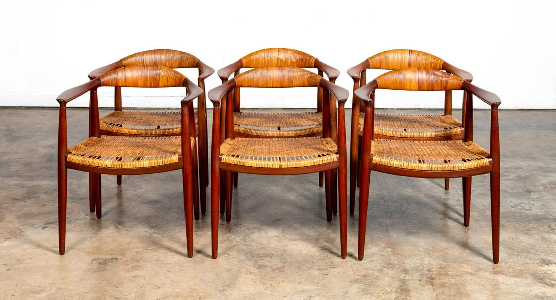 HANS J. WEGNER, THE CHAIR, SET OF 6: Hans Wegner for Johannes Hansen, Danish, mid 20th century. Set of six "The Chair" arm chairs with caned seat and top rail. Branded manufacturer's mark to underside "Johannes Hansen Copenhagen Denmark"