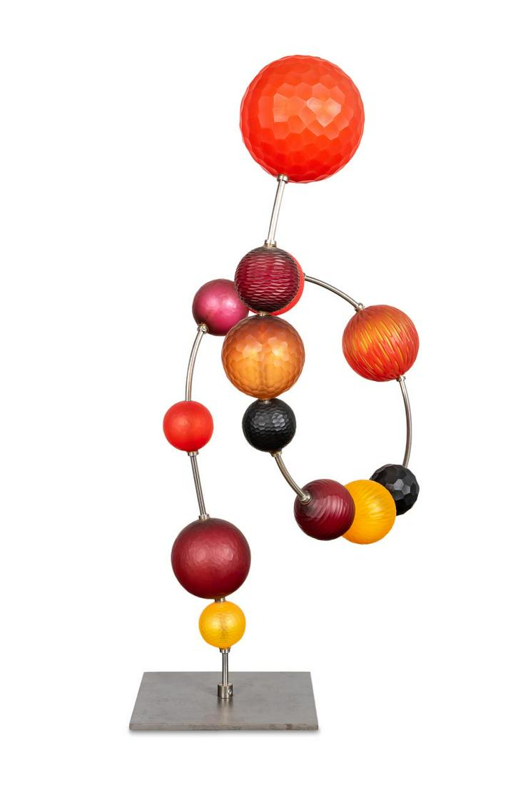 P. BALDWIN & M. GUGGISBERG ART GLASS SCULPTURE: Philip Baldwin and Monica Guggisberg. "Spheres- The Orange Loop" - circa 2016, blown glass and steel, apparently unsigned. Faceted glass balls creating a kinetic sculpture on steel frame. Provenance:
